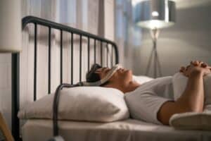 A man with sleep apnea lying on his back