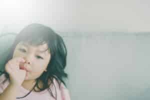 A child sucking her thumb